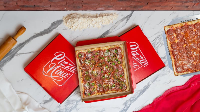 Classic Detroit Red Top Pizza with tomato sauce on top